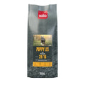 A sleek dark gray 15kg valio puppy large breed premium dog food bag with a red logo and puppy image on the front