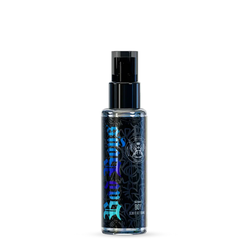 A sleek transparent spray bottle with a black pump and vibrant blue graffiti-style lettering labeled badboys scent boy 100ml