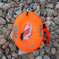 Bright orange grab bag donut buoy inflatable swim ring with blue 360swim branding and pinkish white flotation bag