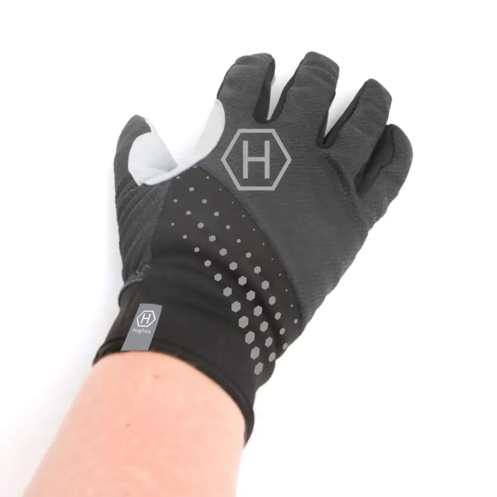 Black and gray haghus polar pro urheilusormikkaat with textured fabric dotted pattern and hexagonal logo on backhand