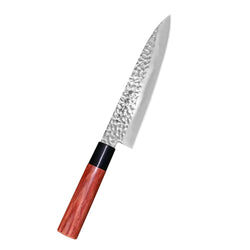 A sleek hammered stainless steel kanetsune seki kc-950 kokkiveitsi knife with reddish-brown wooden handle and black bolster