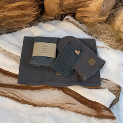 Dark gray linen towel set lahjasetti keittiömestari with textured crocheted accent and branded leather tags