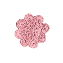 Delicate pink crocheted flower-shaped coaster with textured scalloped edge named lasinalunen pipari