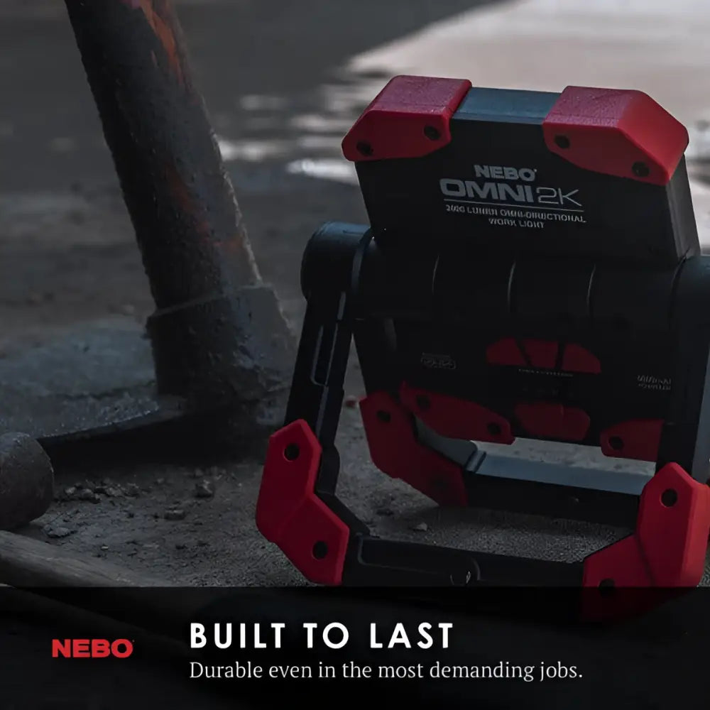 Red and black Nebo OMNI 2K worklight with rugged angular design for durable industrial illumination