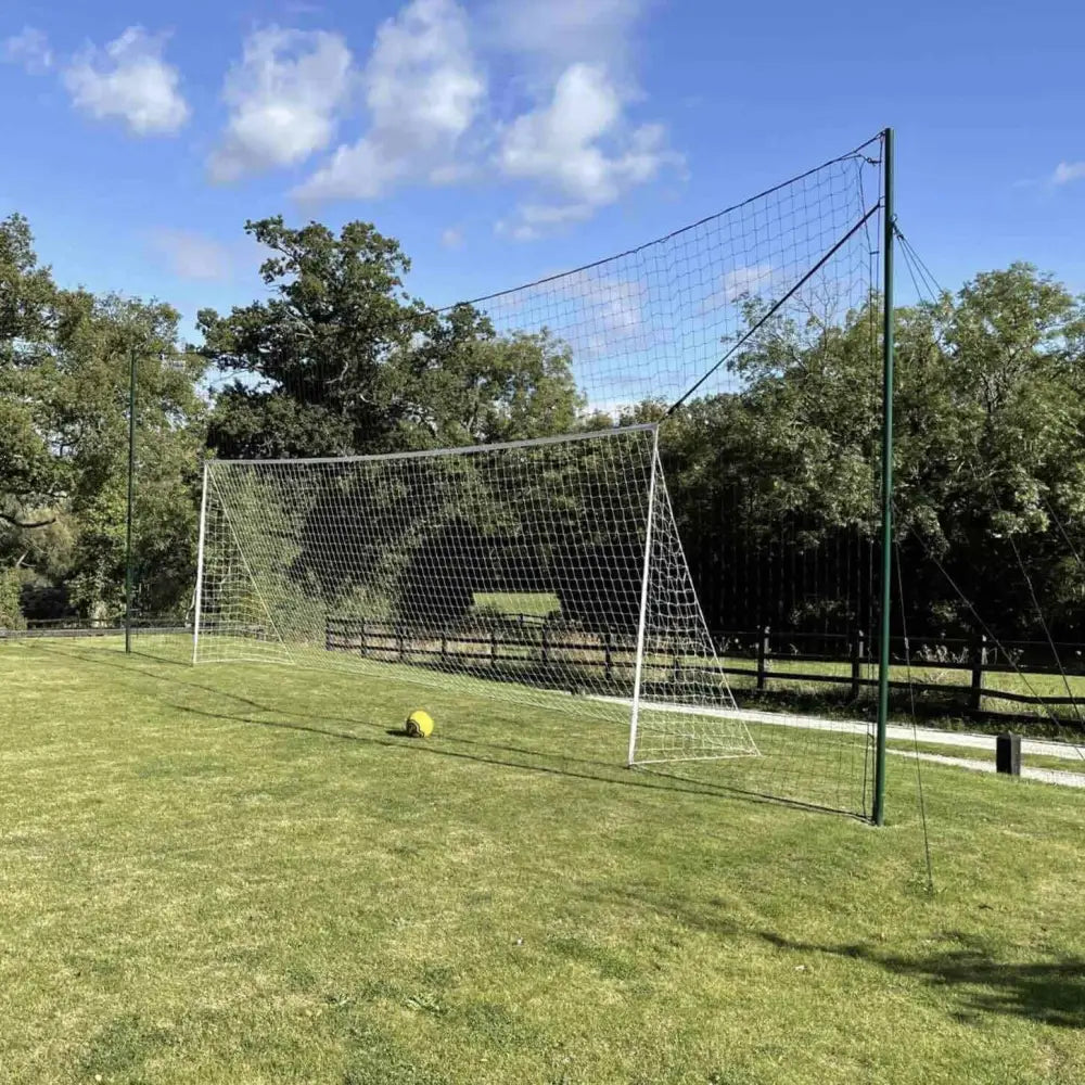 White soccer goal with green posts and yellow ball at base open goaaal football goal 3-in-1 trainer regulation