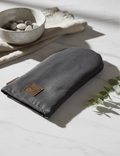 Dark gray fabric pouch patakinnas pellava with brown leather patch and zipper featuring minimalist design