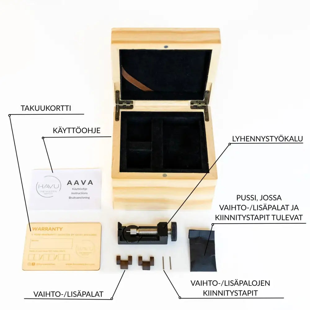 Light-colored wooden box with black velvet interior and metal hinges containing watch repair tools for revontuli eebenpuu 40mm ennakkomyynti
