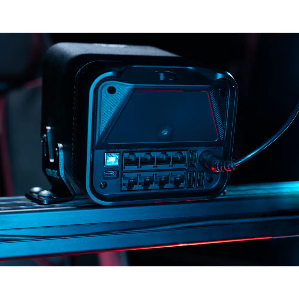 Black rugged network switch with illuminated blue led ports and red accent lighting for simagic alpha evo pro wheelbase 18nm