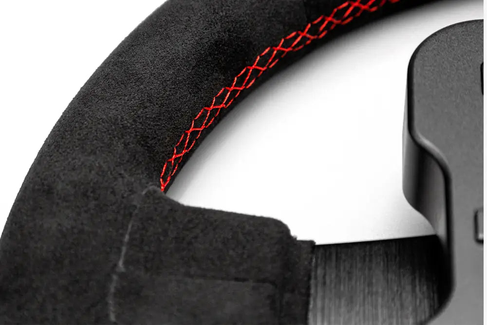 Simagic gt1 rounded steering wheel with black suede cover and red stitching for enhanced grip and style