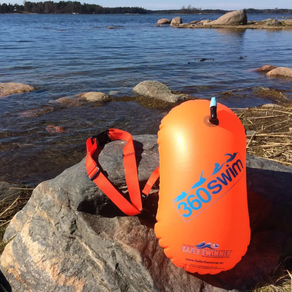 Bright orange inflatable tow float with 360swim branding and matching adjustable strap for swim safety