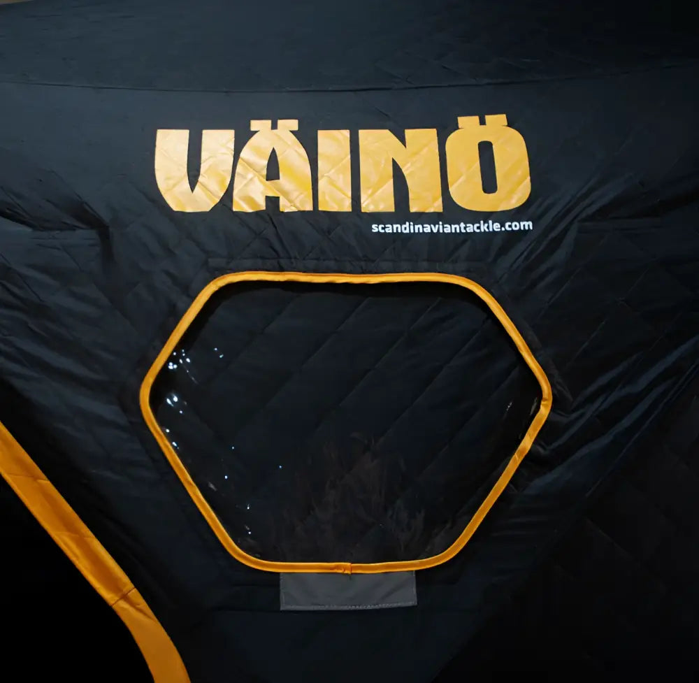 Black and yellow väinö bunker thermal extreme xxxl pilkkiteltta with hexagonal window visible