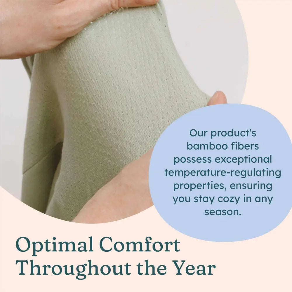 Pehmeä vaaleanvihreä bambukuitukangasta sisältävä juniorin weighted sleep suit i BABYDEEPSLEEP®-painopeittohaalari